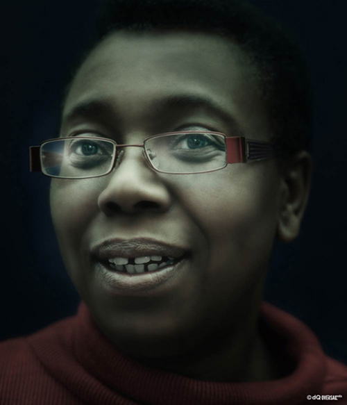 Portrait of a smiling black woman in a red sweater wearing red glasses SKU: po-0007